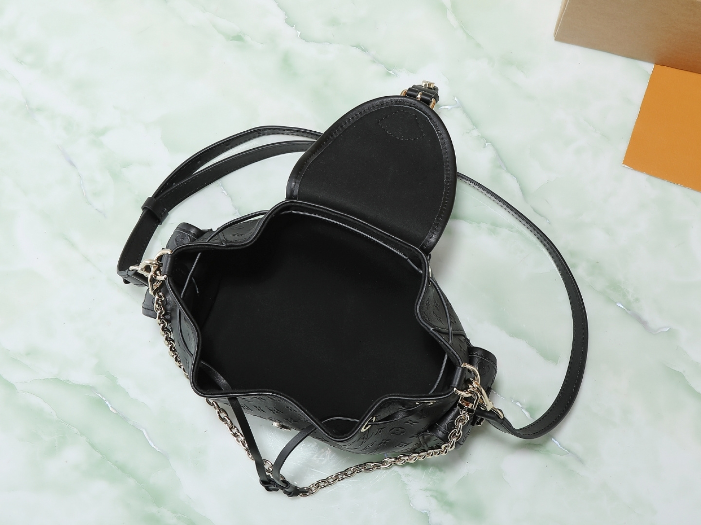 Louis Vuitton The M25554 Odyssée handbag in black full leather, hailing from the Early Autumn 2025 collection, cleverly references the 2024 Cruise collection.