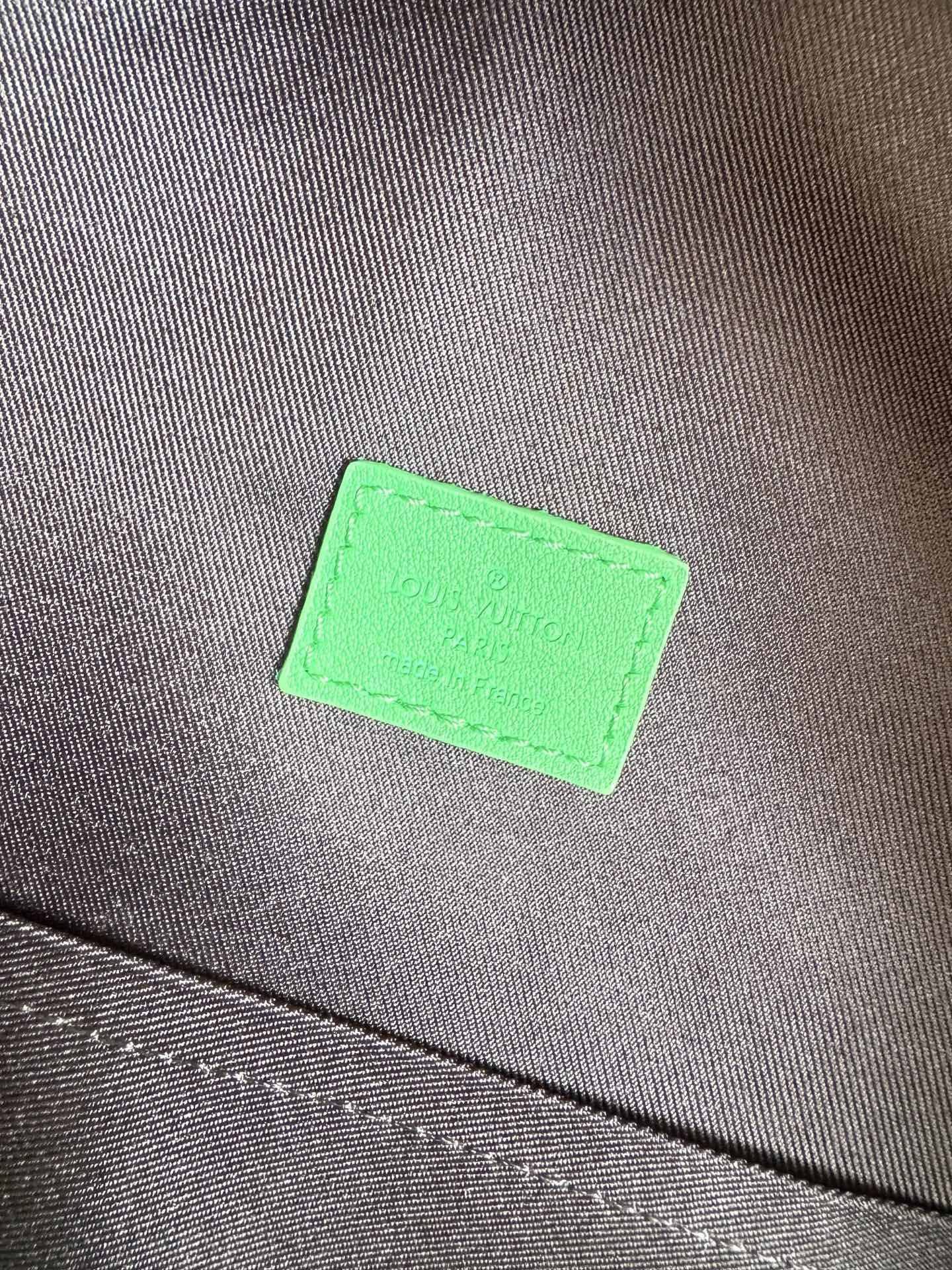 Louis Vuitton This small Discovery backpack features a patchwork of Monogram Eclipse canvas and vibrant cowhide leather.