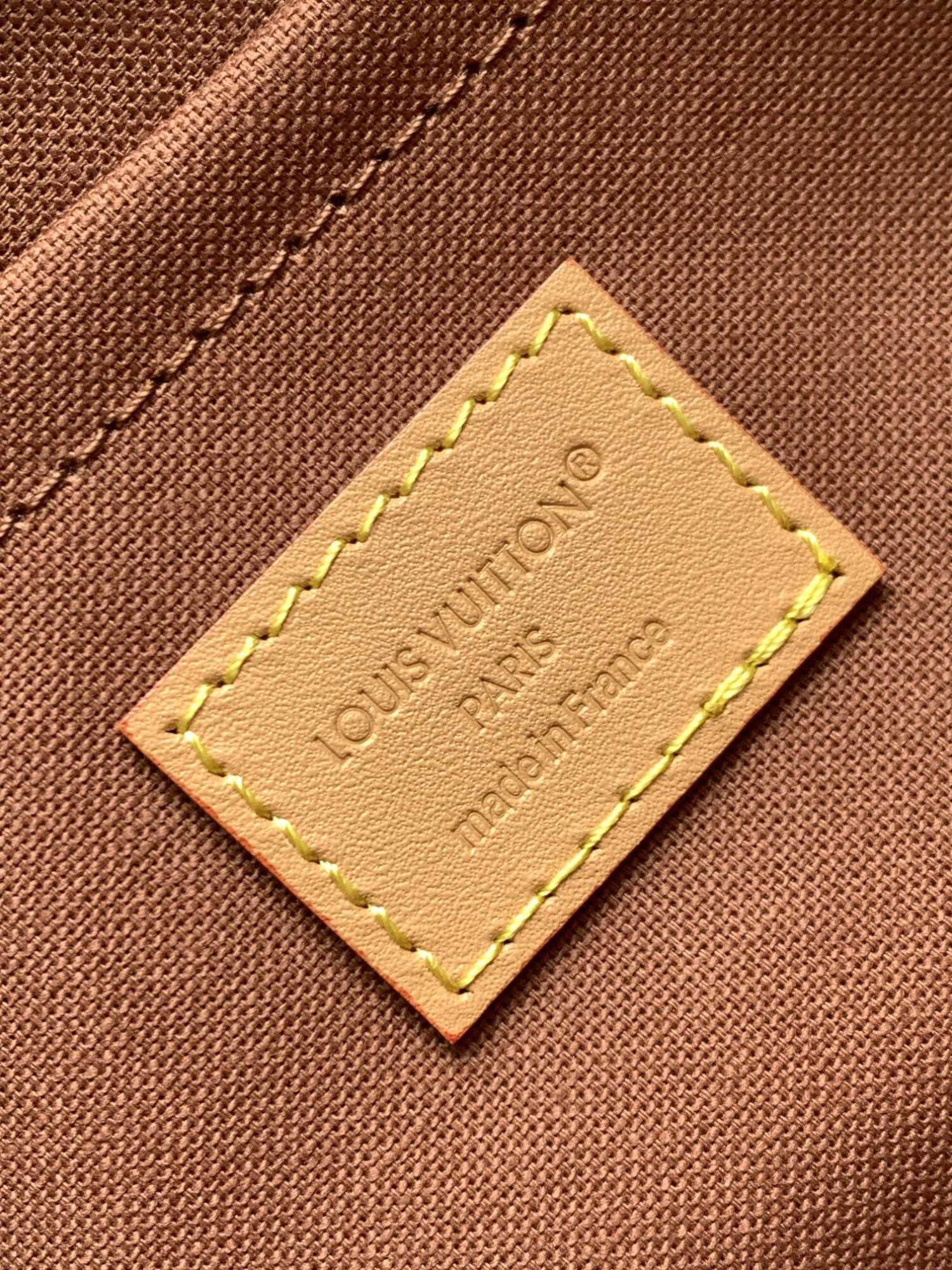 Louis Vuitton This Nil messenger bag features a Monogram canvas body accented with Damier and Monogram Reverse canvas patches, creating an elegant patchwork effect.