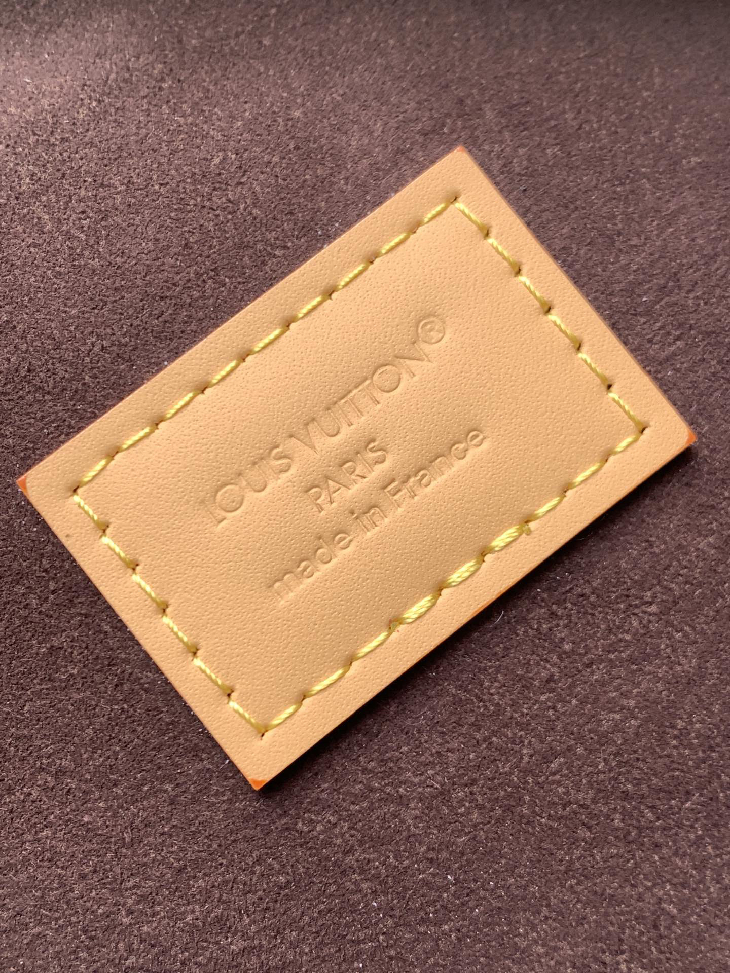 Louis Vuitton This Pochette Mia handbag, part of the Monogram collection, features a Monogram canvas body accented with cowhide leather trim.