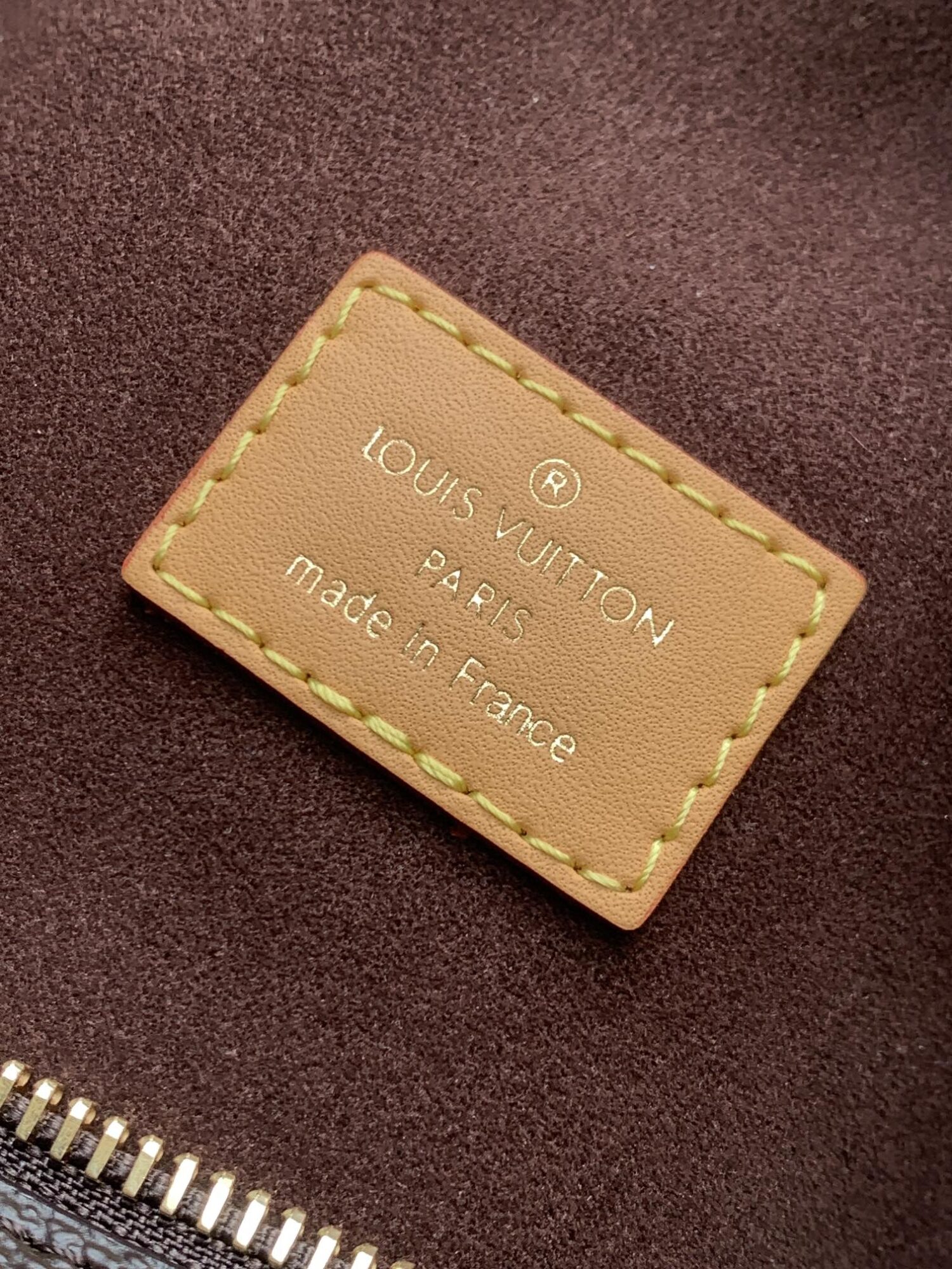 Louis Vuitton This large Side Trunk handbag features Monogram canvas accented with contrasting leather trim.