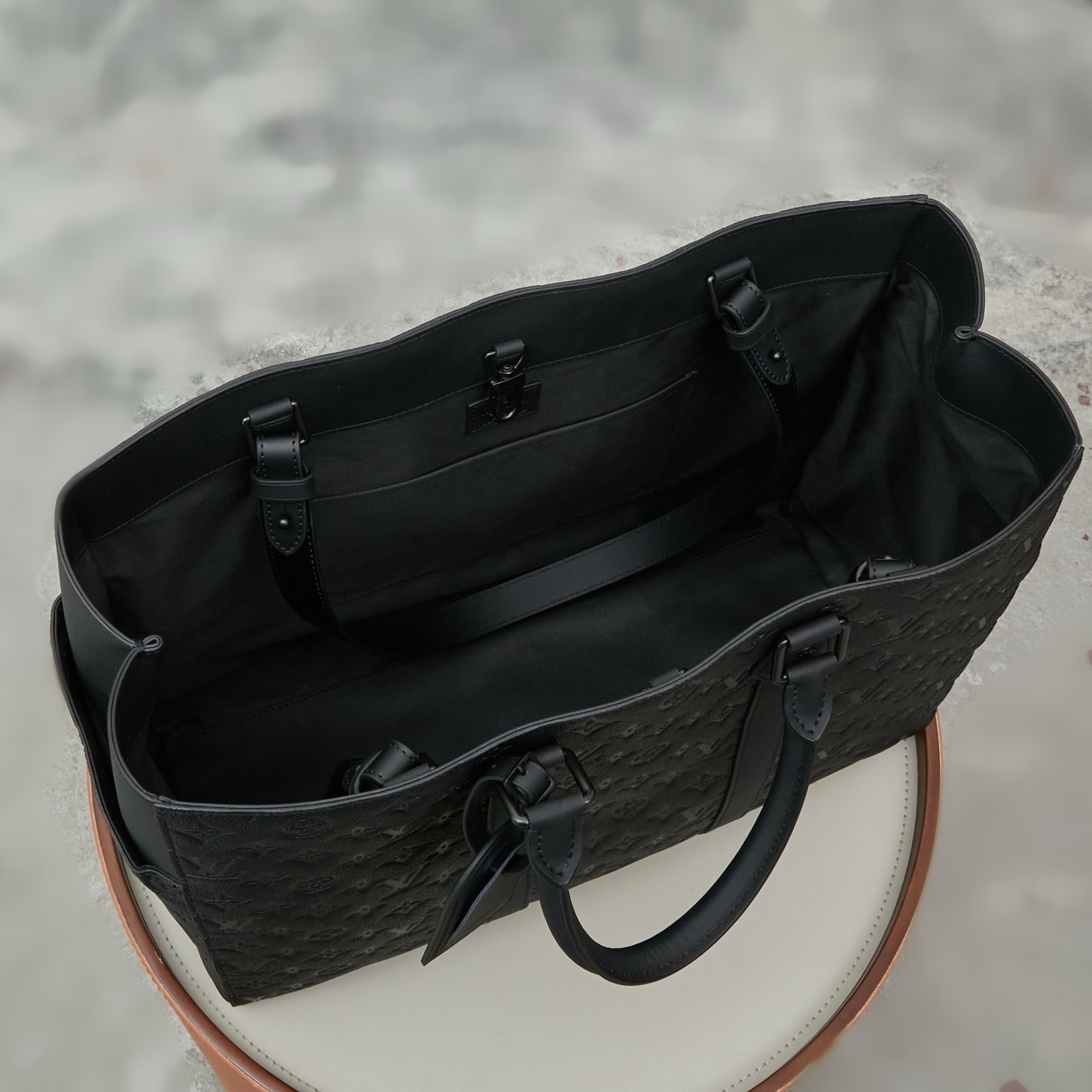 Louis Vuitton This Sac Plat 24H bag is crafted from Monogram-embossed Taurillon leather.