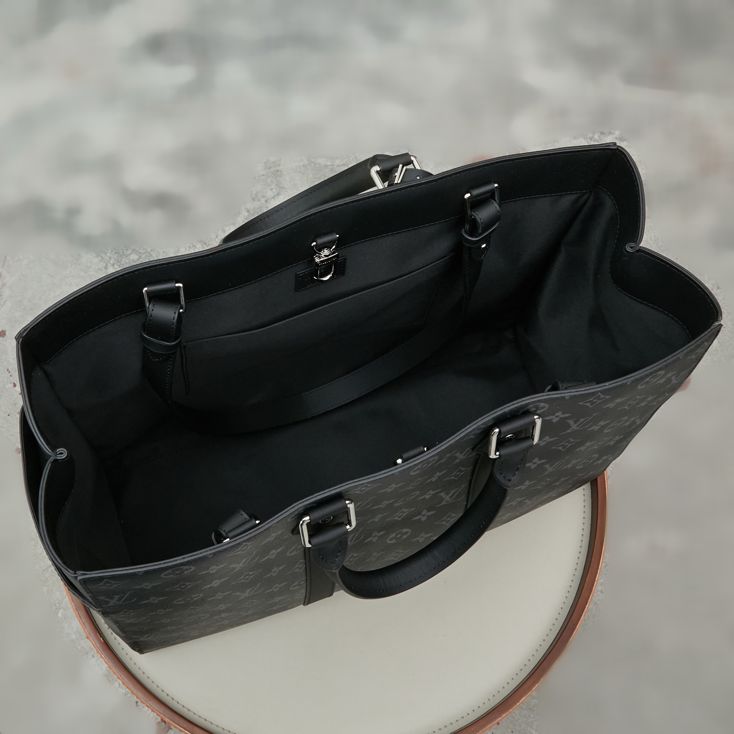 Louis Vuitton M46451 Black Monogram: A spacious handbag from the Sac Plat collection, the Sac Plat 24H features leather trim.