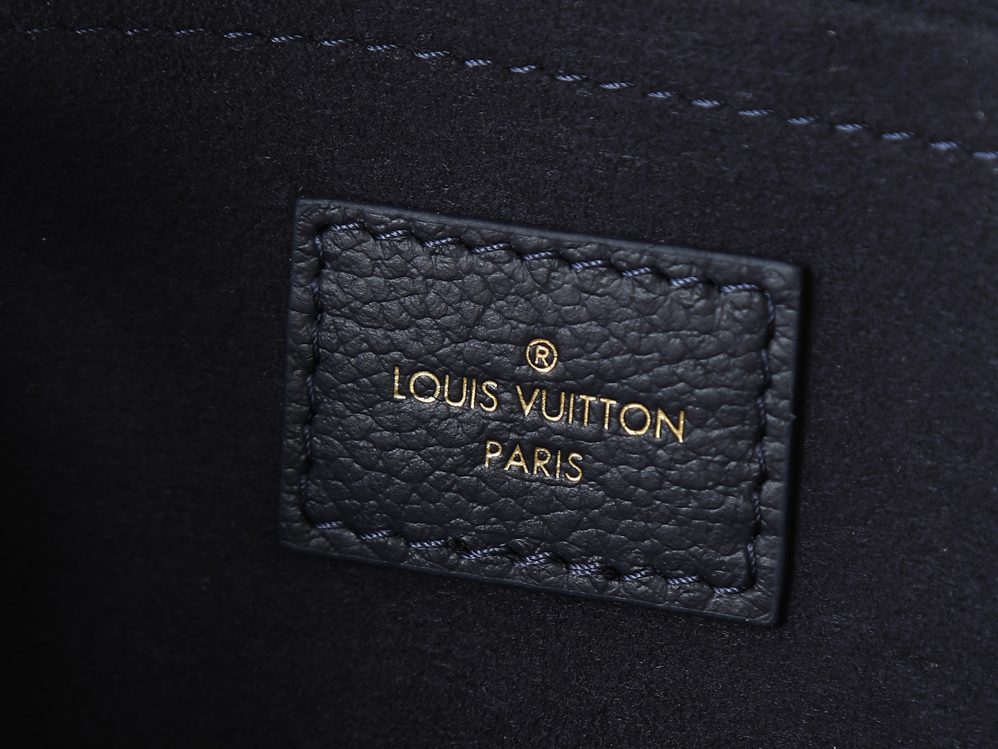 Louis Vuitton M23640 Deep Blue Embossed: This small OnTheGo handbag is crafted from Monogram Empreinte leather, embossed with the Giant Monogram pattern.