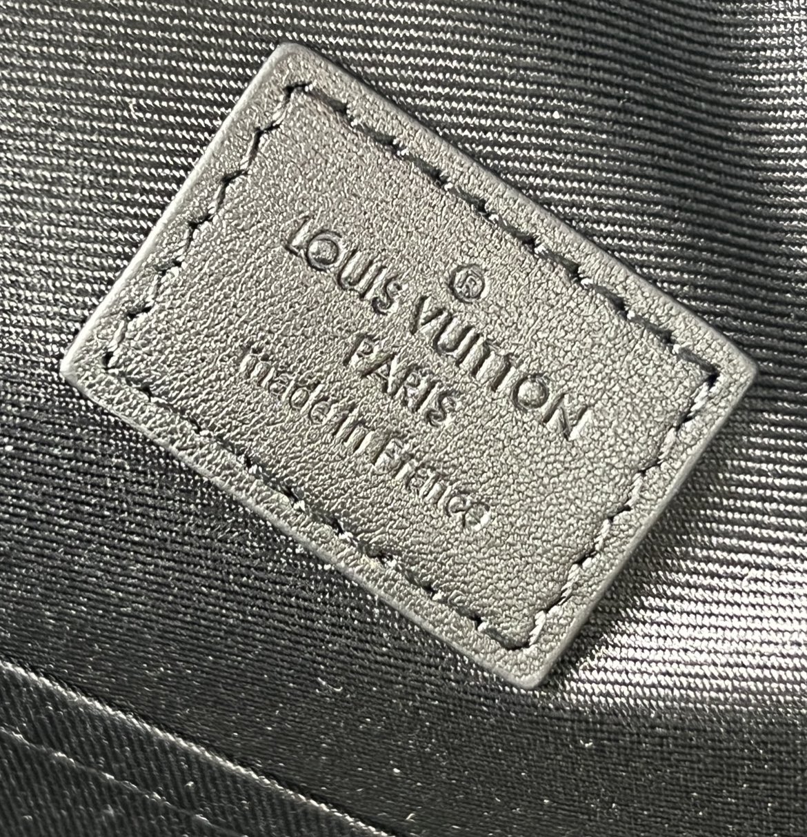 Crafted from Monogram Eclipse canvas, this small Discovery backpack retains its versatile functionality in a more compact silhouette.