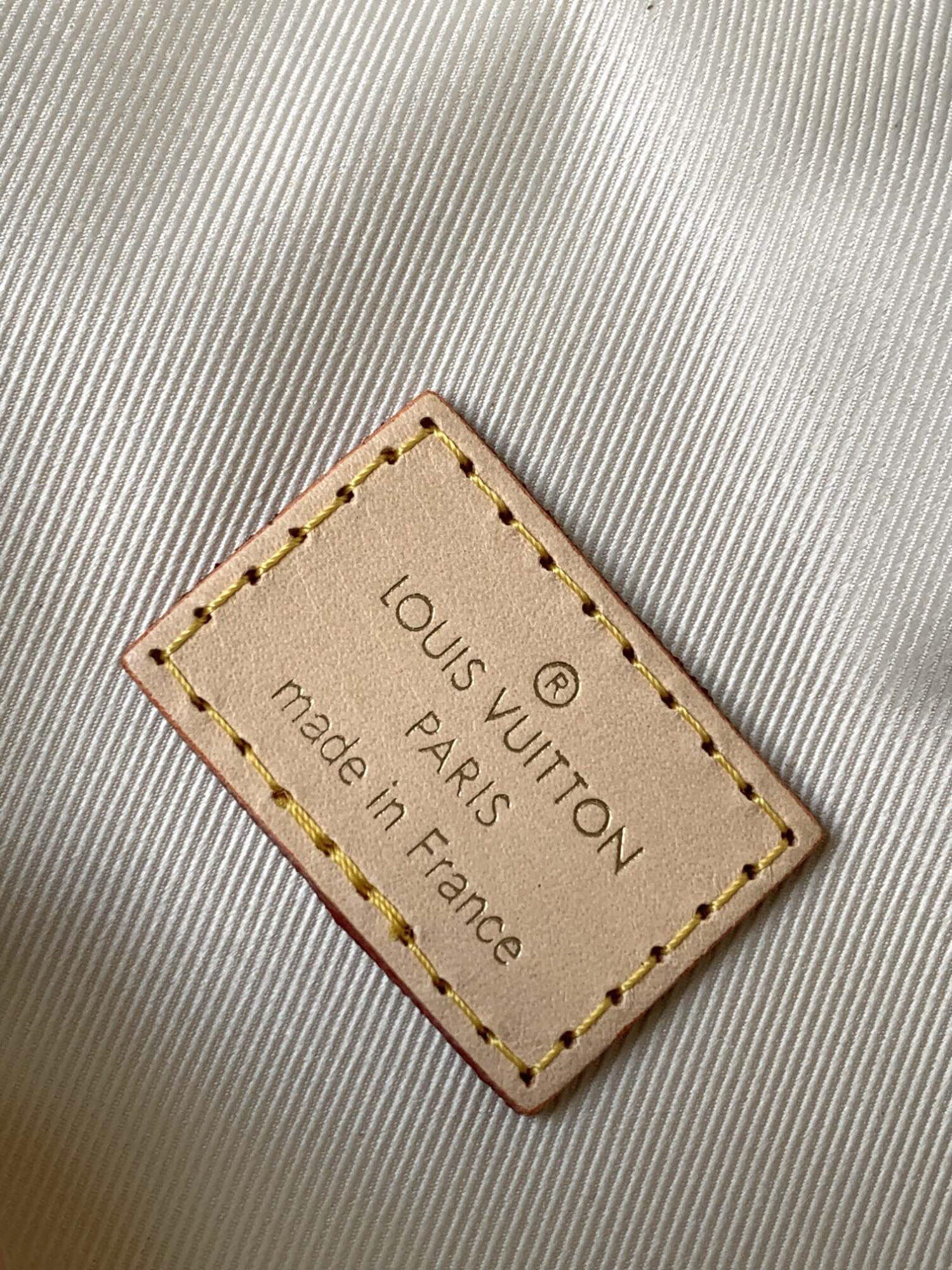 Louis Vuitton The M46784 High-Rise Bag is crafted from Montaigne-coated canvas.