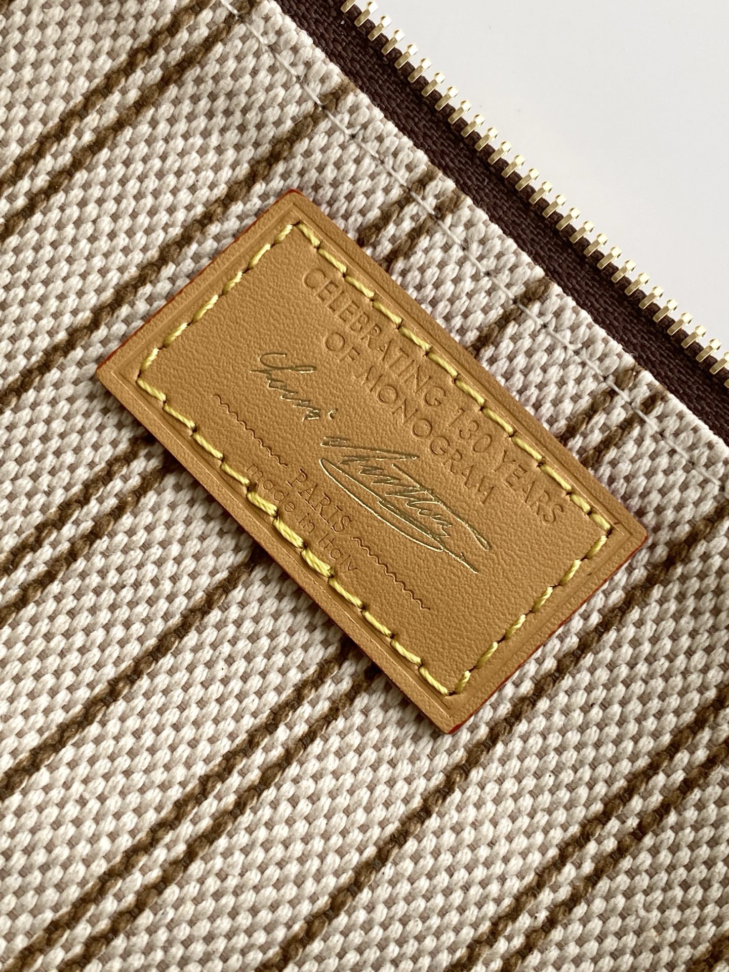 Louis Vuitton This Pochette Accessoires handbag is specially designed to celebrate the birth of the Louis Vuitton Monogram pattern.