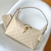 Louis Vuitton The Sac Sport handbag features a curved silhouette crafted from supple Monogram Empreinte embossed leather.