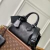 Louis Vuitton The M23807 black Speedy P9 Bandoulière 20 handbag is crafted from glossy calfskin leather.