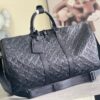 Louis Vuitton The new version of the M44810 Keepall Bandoulière 50 travel bag features the Monogram Shadow design.