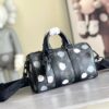 Louis Vuitton M46406 Black Floral Polka Dot Yayoi Kusama Handbag: This handbag encapsulates the classic silhouette of a travel bag and is crafted from embossed leather.