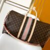 Louis Vuitton The Keepall Bandoulière 55 travel bag cleverly utilizes Monogram canvas to create ample space.
