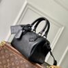 Louis Vuitton The M23807 black Speedy P9 Bandoulière 20 handbag is crafted from glossy calfskin leather.