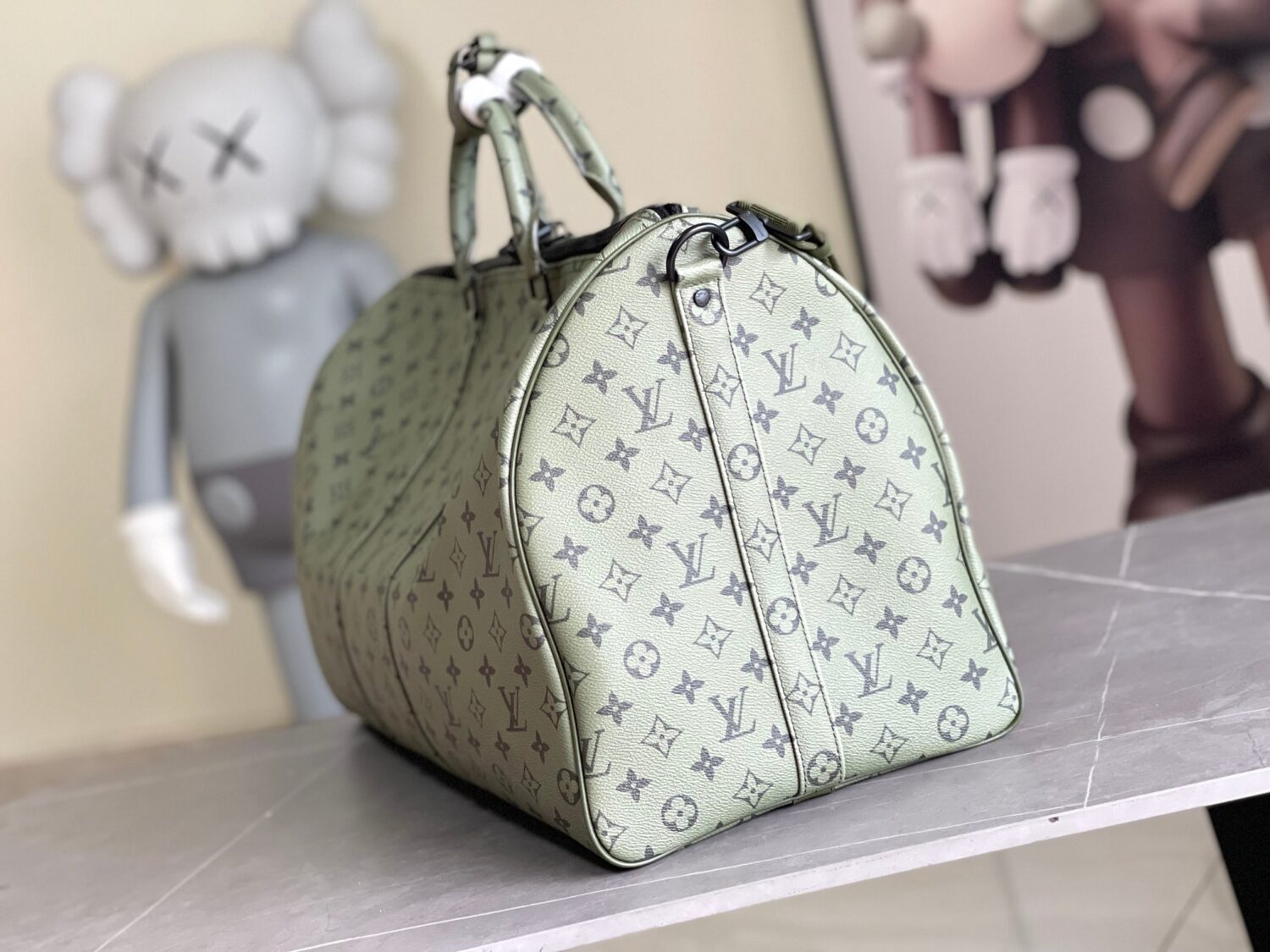 Louis Vuitton Keepall size 45 travel bag, style numbers 23962 and 23963, dyed in a pastel hue reminiscent of the rising sun.