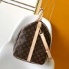 Louis Vuitton The Keepall Bandoulière 55 travel bag cleverly utilizes Monogram canvas to create ample space.
