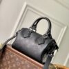 Louis Vuitton The M23807 black Speedy P9 Bandoulière 20 handbag is crafted from glossy calfskin leather.