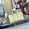 Louis Vuitton M14078 Light Khaki Green Pillow Bag. This Keepall 25 handbag is made of Monogram Eclipse Reverse canvas.