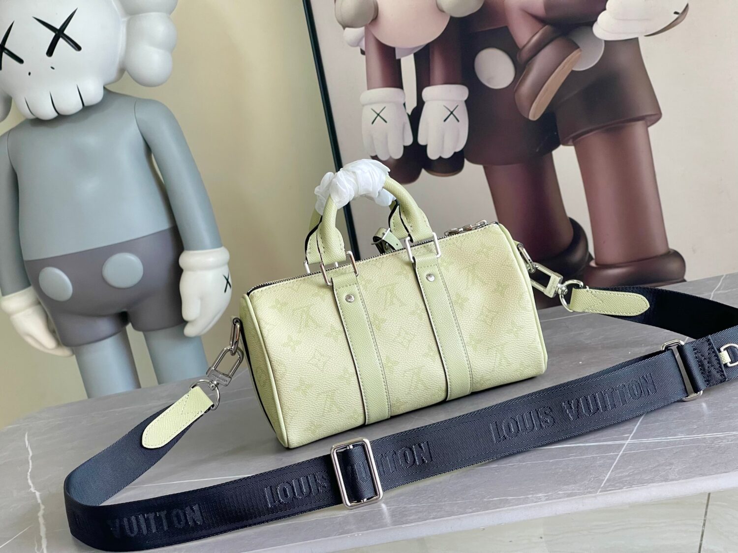Louis Vuitton M14078 Light Khaki Green Pillow Bag. This Keepall 25 handbag is made of Monogram Eclipse Reverse canvas.