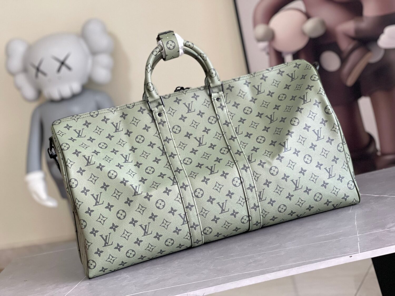 Louis Vuitton Keepall size 45 travel bag, style numbers 23962 and 23963, dyed in a pastel hue reminiscent of the rising sun.