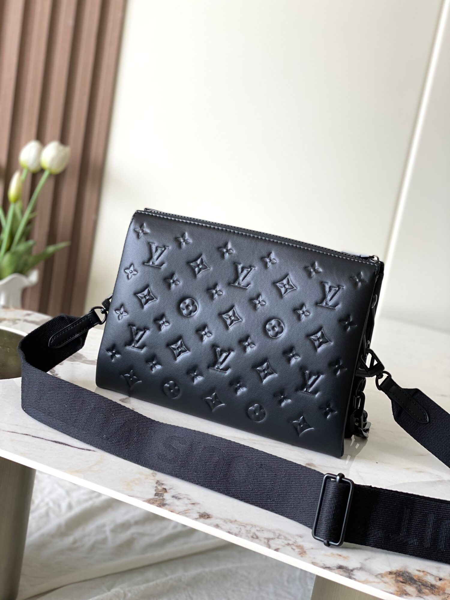 Louis Vuitton M11370 Black embossed leather bag with black chain.