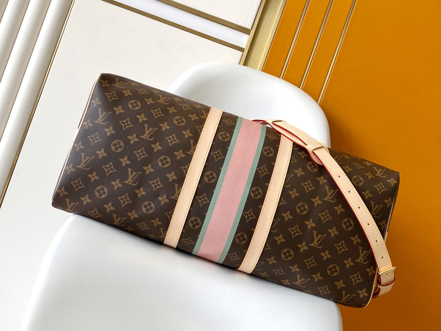 Louis Vuitton The Keepall Bandoulière 55 travel bag cleverly utilizes Monogram canvas to create ample space.
