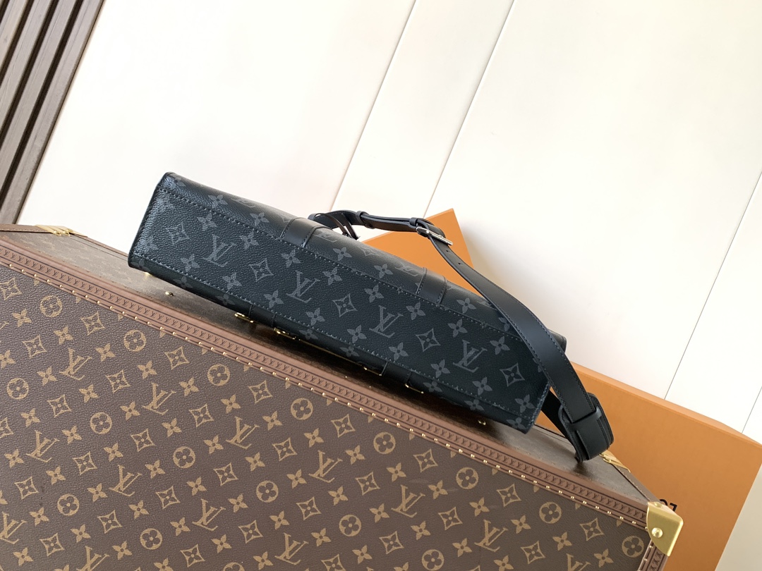 Louis Vuitton The M11742 black floral briefcase with zipper and 163C microcode chip is a Sac Plat 24H handbag with the elegant style of Monogram Eclipse coated canvas.