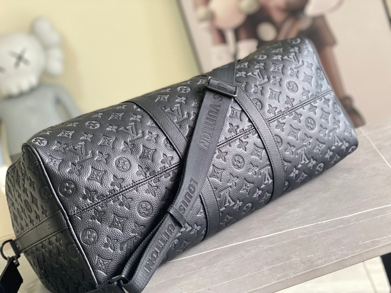 Louis Vuitton The new version of the M44810 Keepall Bandoulière 50 travel bag features the Monogram Shadow design.