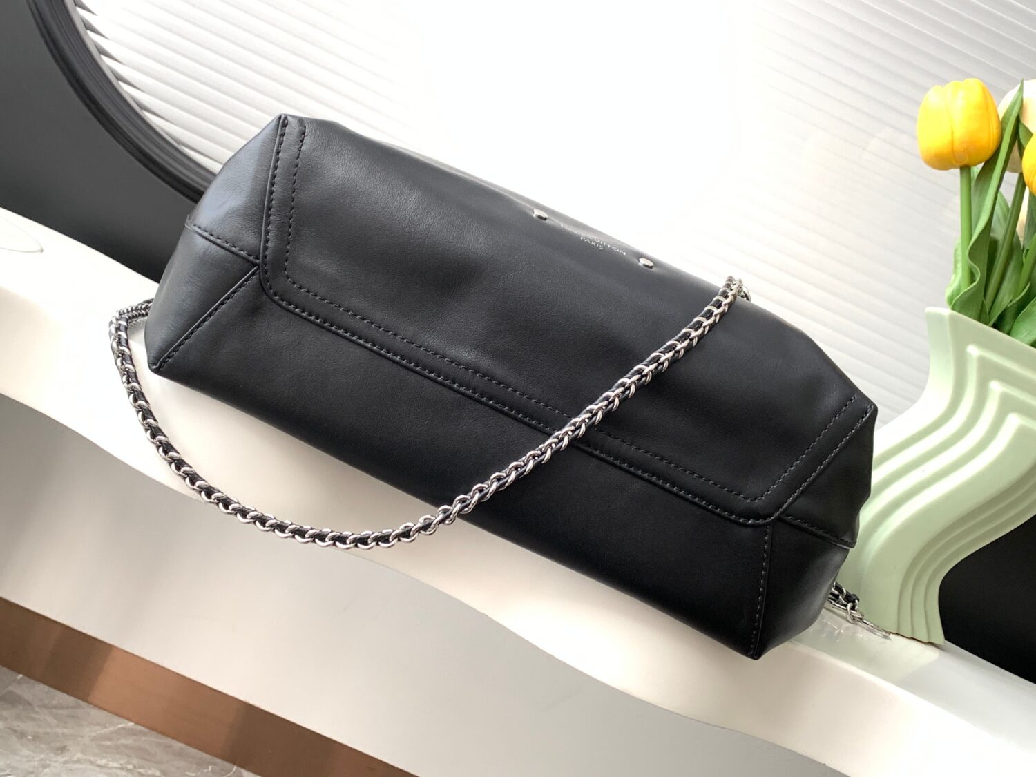 Louis Vuitton The M11266 Atlantis medium handbag is from the Dark Side collection.