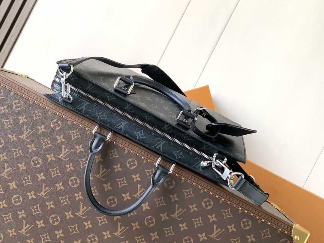 Louis Vuitton The M11742 black floral briefcase with zipper and 163C microcode chip is a Sac Plat 24H handbag with the elegant style of Monogram Eclipse coated canvas.