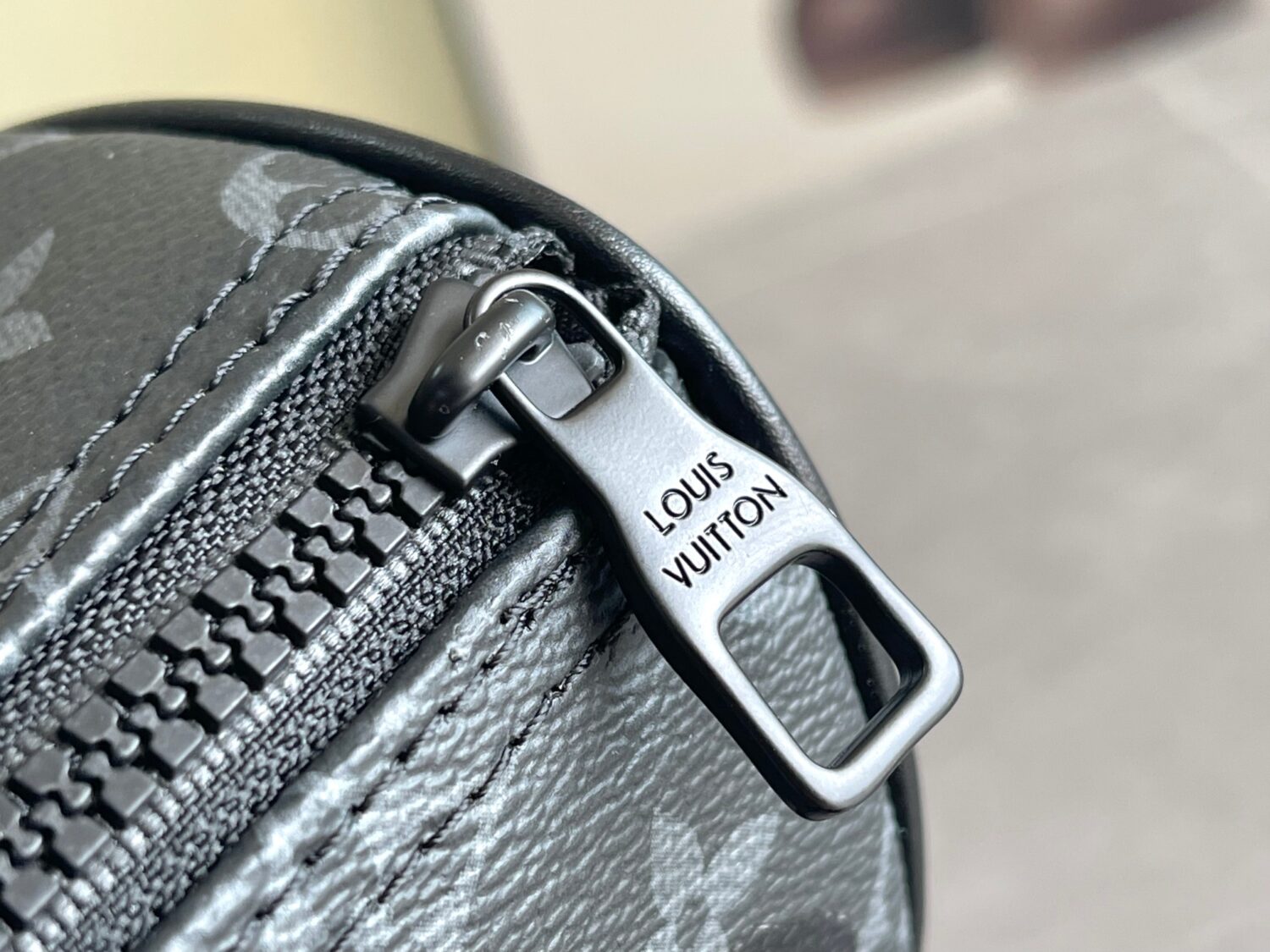 Louis Vuitton M46406 Black Floral Polka Dot Yayoi Kusama Handbag: This handbag encapsulates the classic silhouette of a travel bag and is crafted from embossed leather.