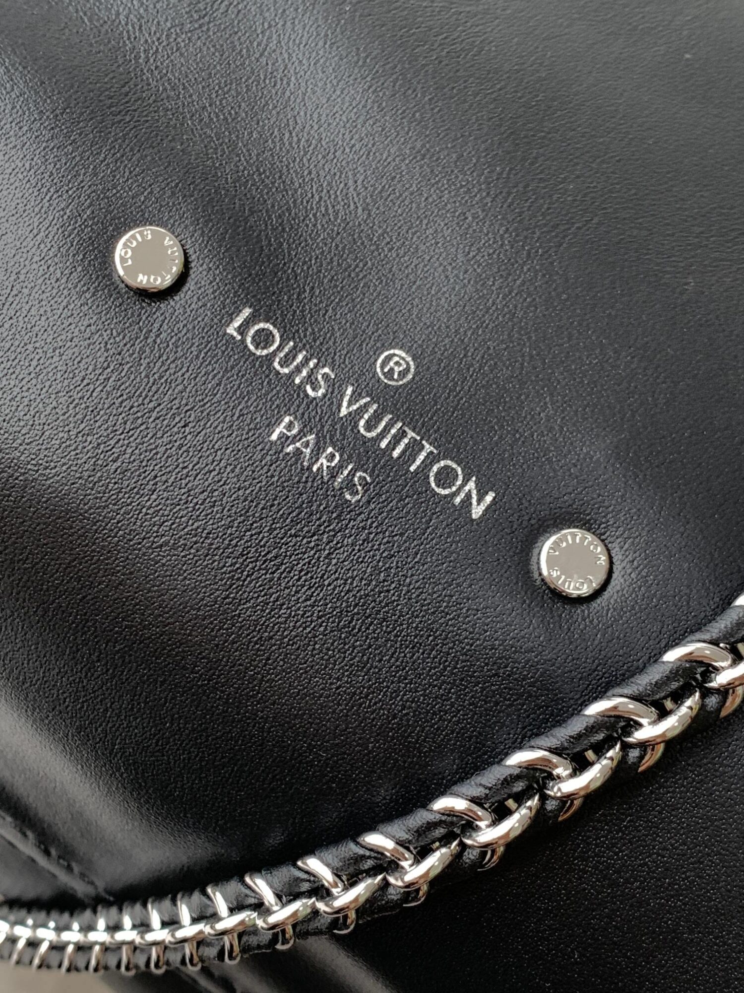 Louis Vuitton The M11266 Atlantis medium handbag is from the Dark Side collection.