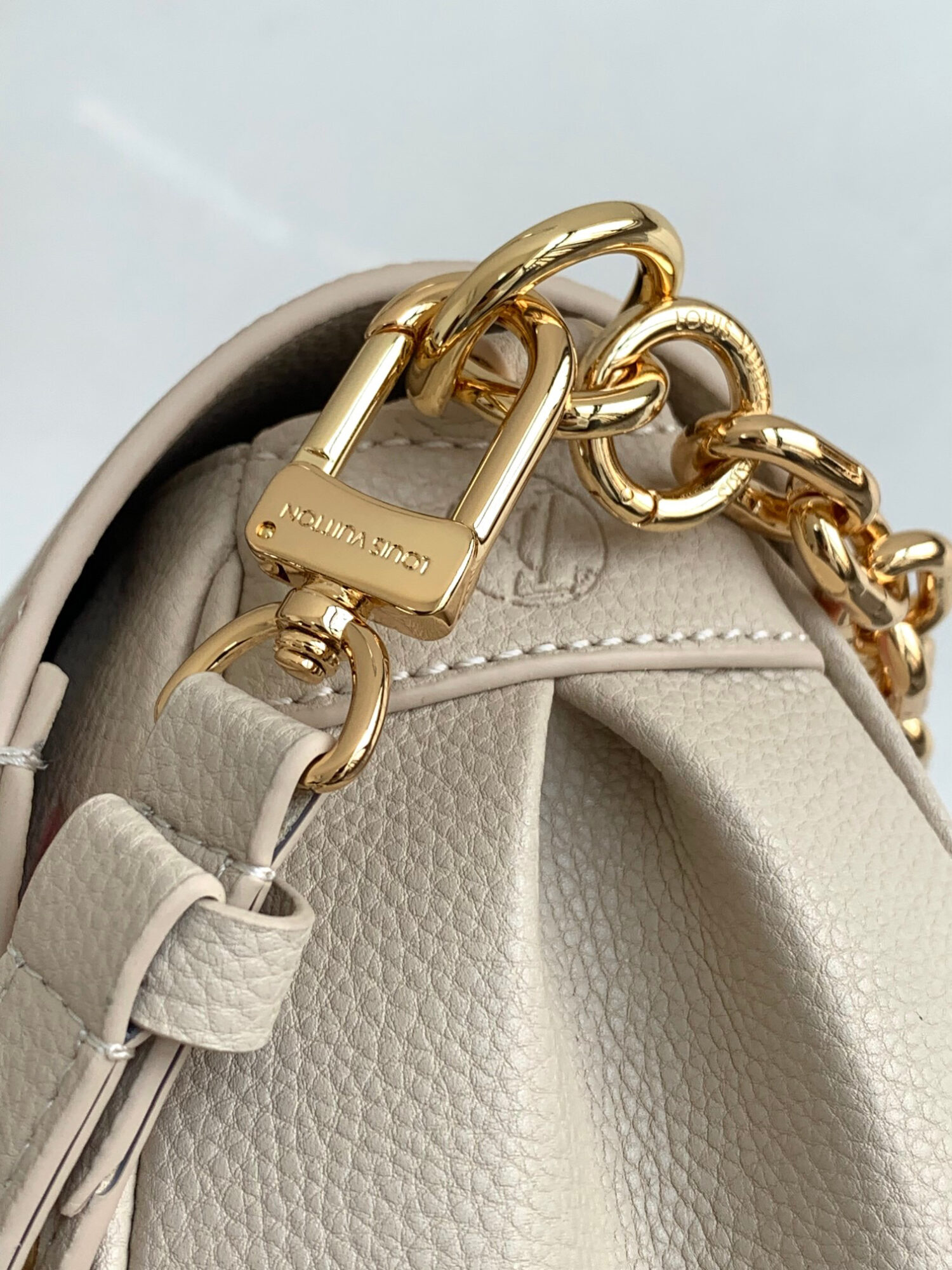 Louis Vuitton The M46393 Favorite handbag is crafted from Monogram Empreinte embossed leather.