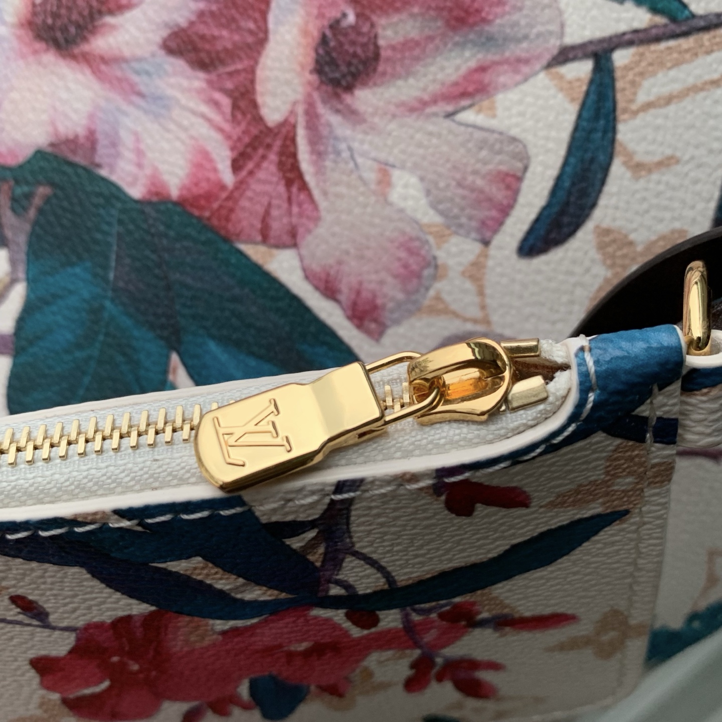 Louis Vuitton The M29067 floral all-in-one BB handbag is from the Monogram Eden collection.