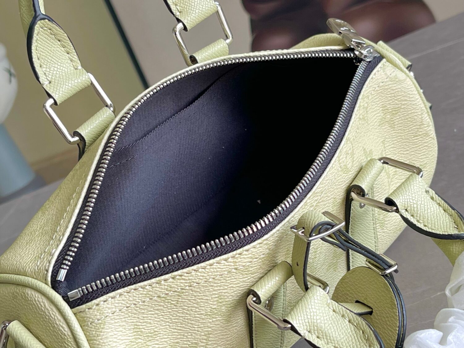 Louis Vuitton M14078 Light Khaki Green Pillow Bag. This Keepall 25 handbag is made of Monogram Eclipse Reverse canvas.