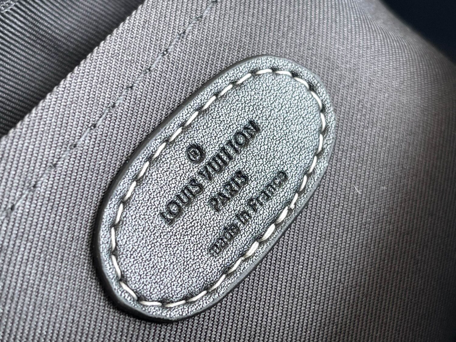 Louis Vuitton M46406 Black Floral Polka Dot Yayoi Kusama Handbag: This handbag encapsulates the classic silhouette of a travel bag and is crafted from embossed leather.