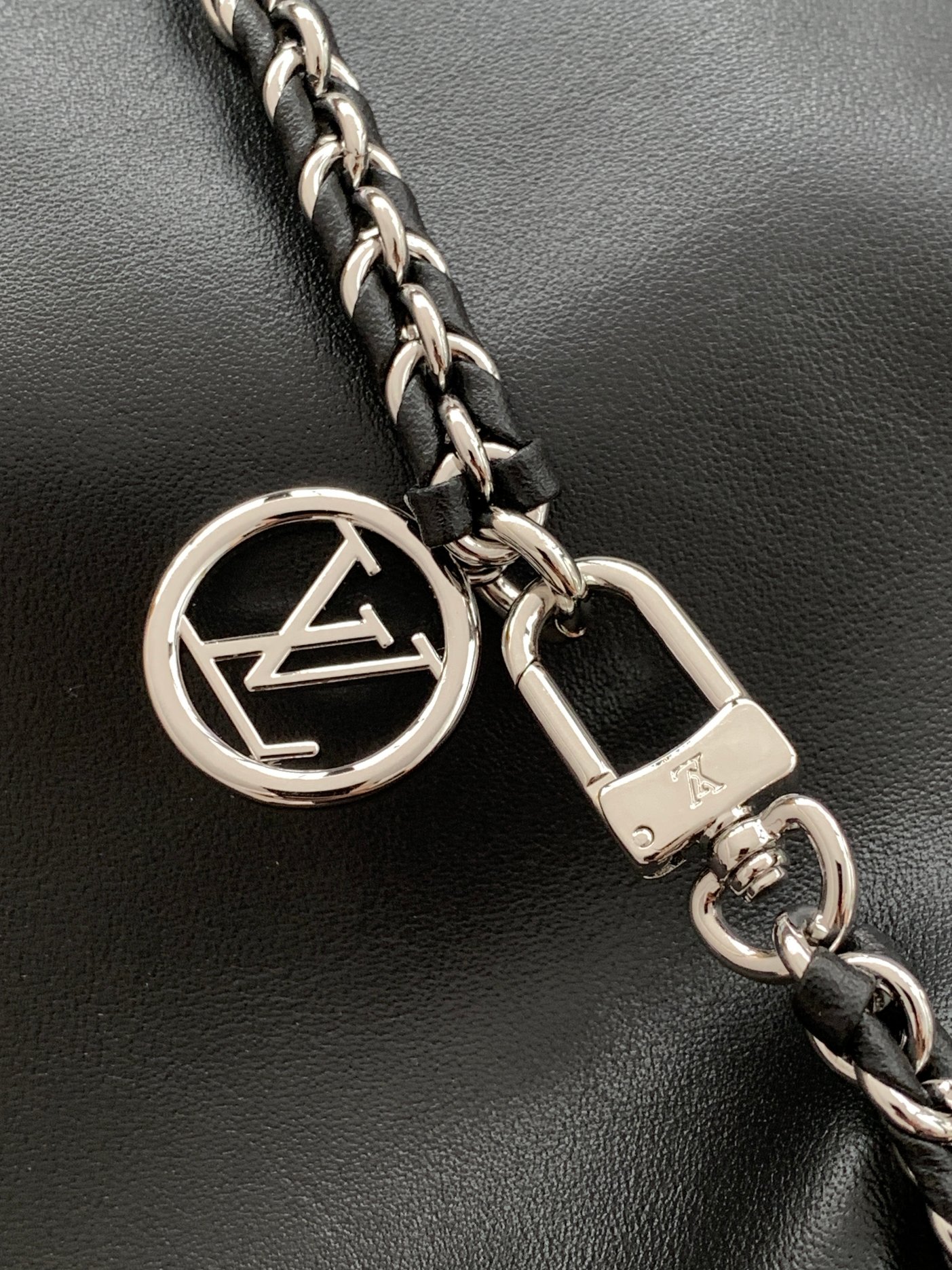 Louis Vuitton The M11266 Atlantis medium handbag is from the Dark Side collection.