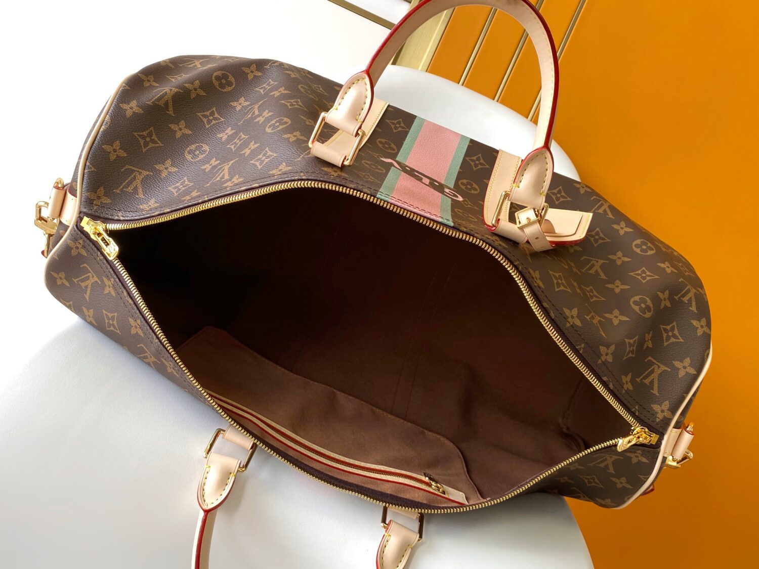 Louis Vuitton The Keepall Bandoulière 55 travel bag cleverly utilizes Monogram canvas to create ample space.