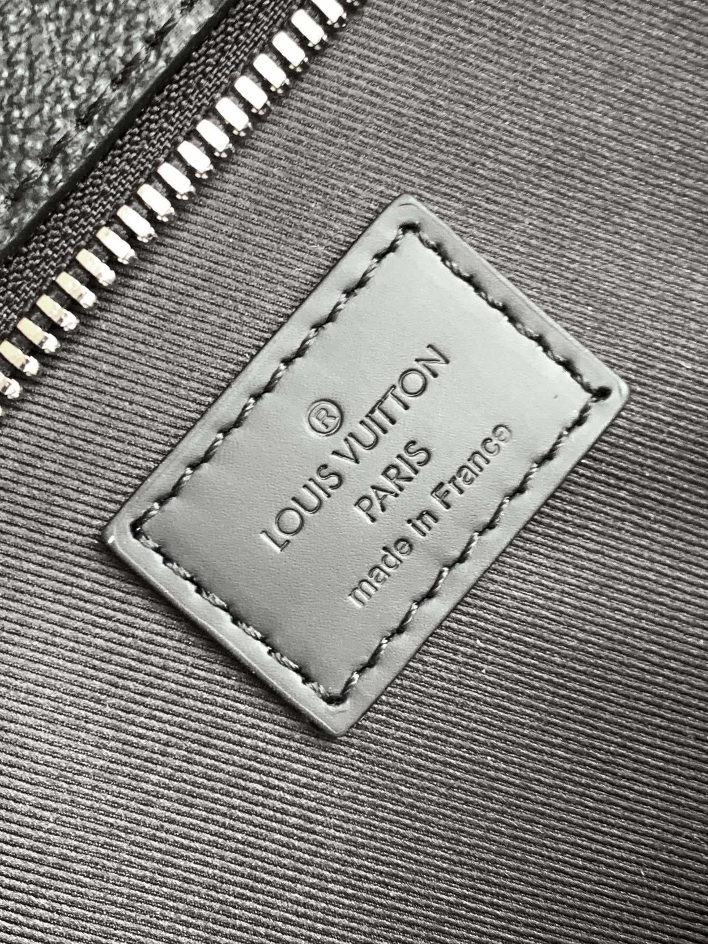 Louis Vuitton The M11742 black floral briefcase with zipper and 163C microcode chip is a Sac Plat 24H handbag with the elegant style of Monogram Eclipse coated canvas.