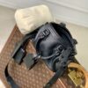 Louis Vuitton The M23807 black Speedy P9 Bandoulière 20 handbag is crafted from glossy calfskin leather.