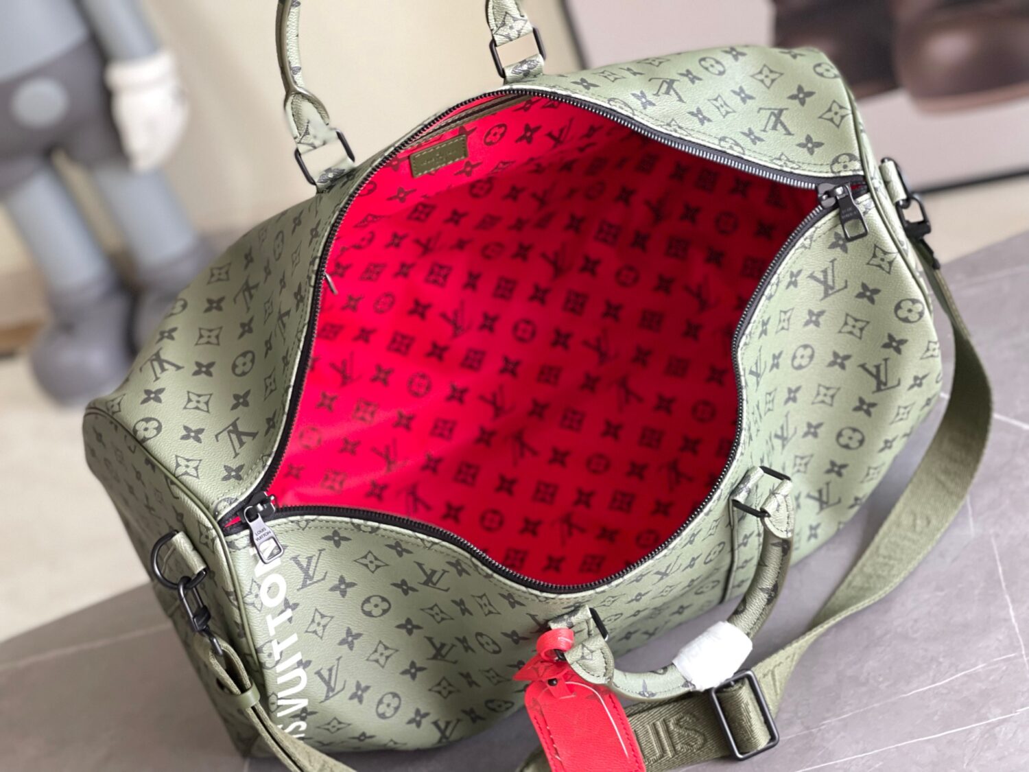 Louis Vuitton Keepall size 45 travel bag, style numbers 23962 and 23963, dyed in a pastel hue reminiscent of the rising sun.